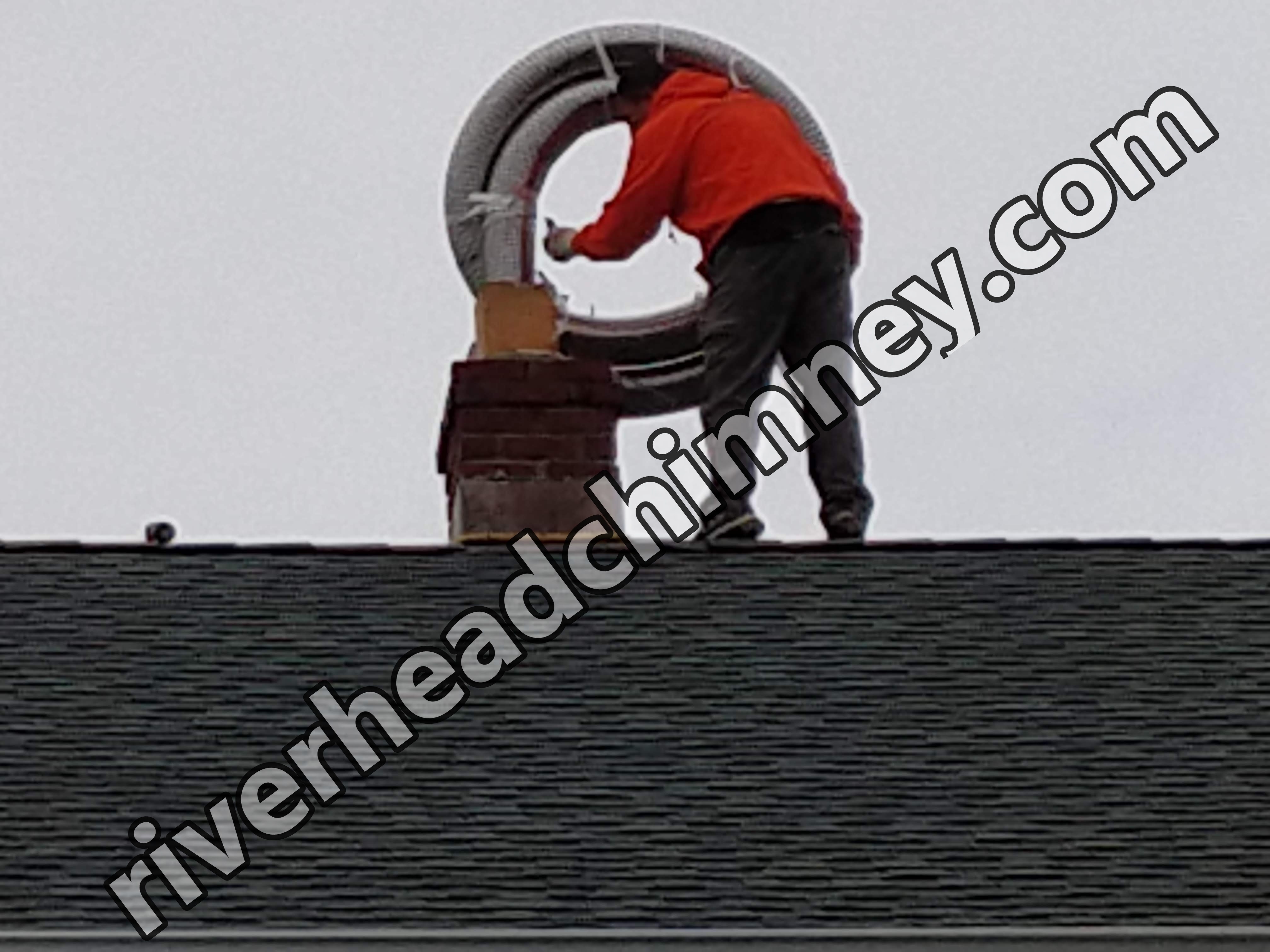 Flexible stainless chimney liner being installed in Riverhead, New York